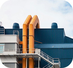 Industrial plant with orange pipes and blue cladding